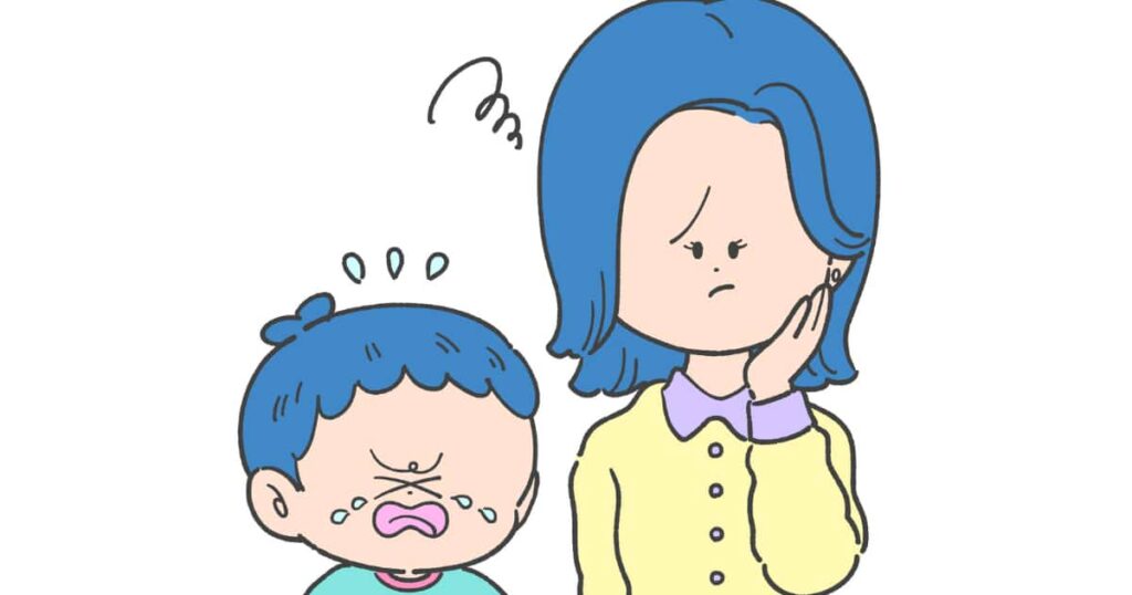 イヤイヤ期に見守る親子の画像